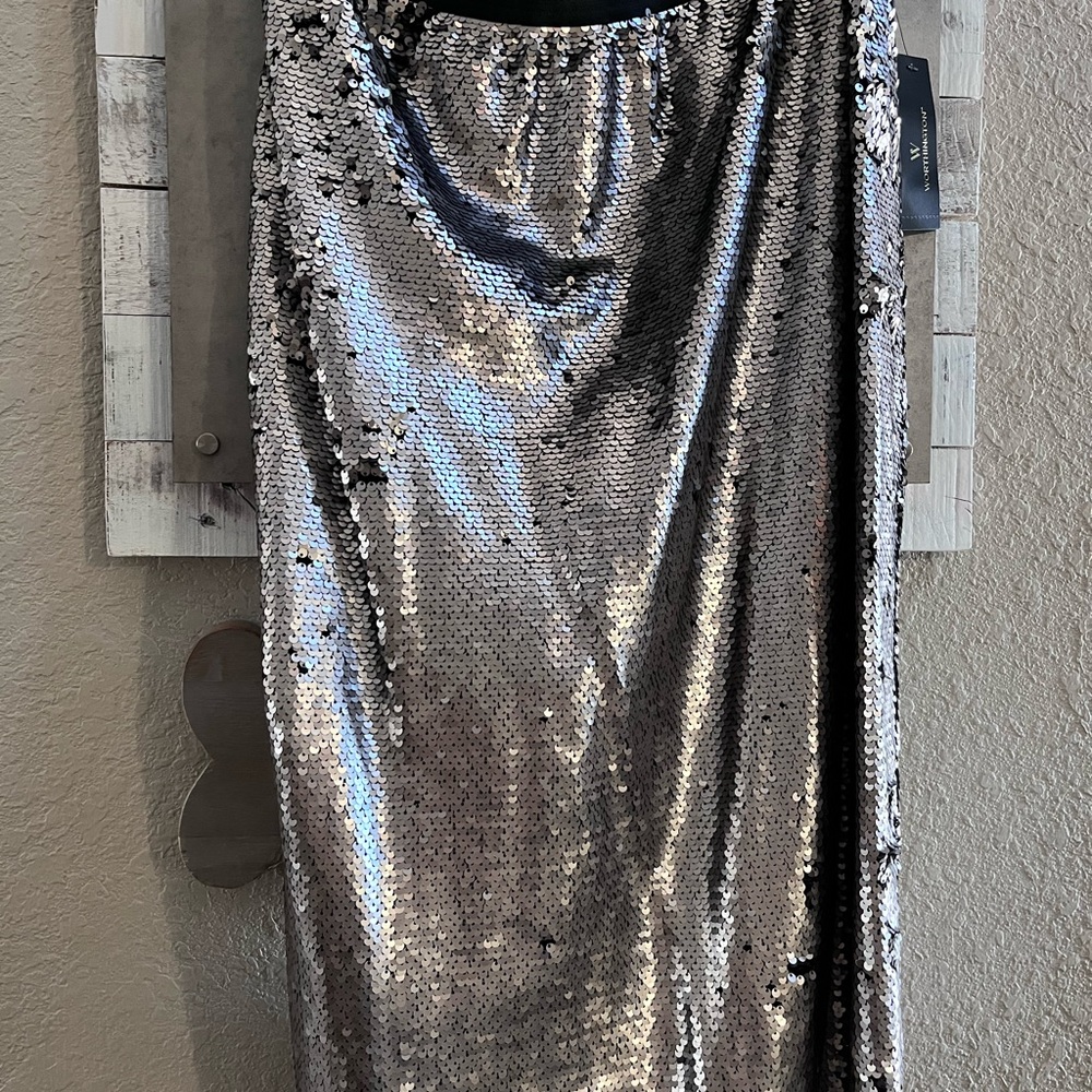 Silver sequin skirt, hits just below the knee.  Never worn.